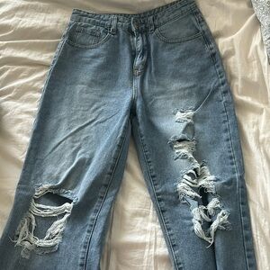 High waisted light washed ripped jeans